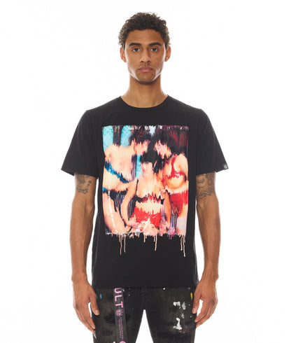 Person wearing a black t-shirt with a colorful graphic design on a white background