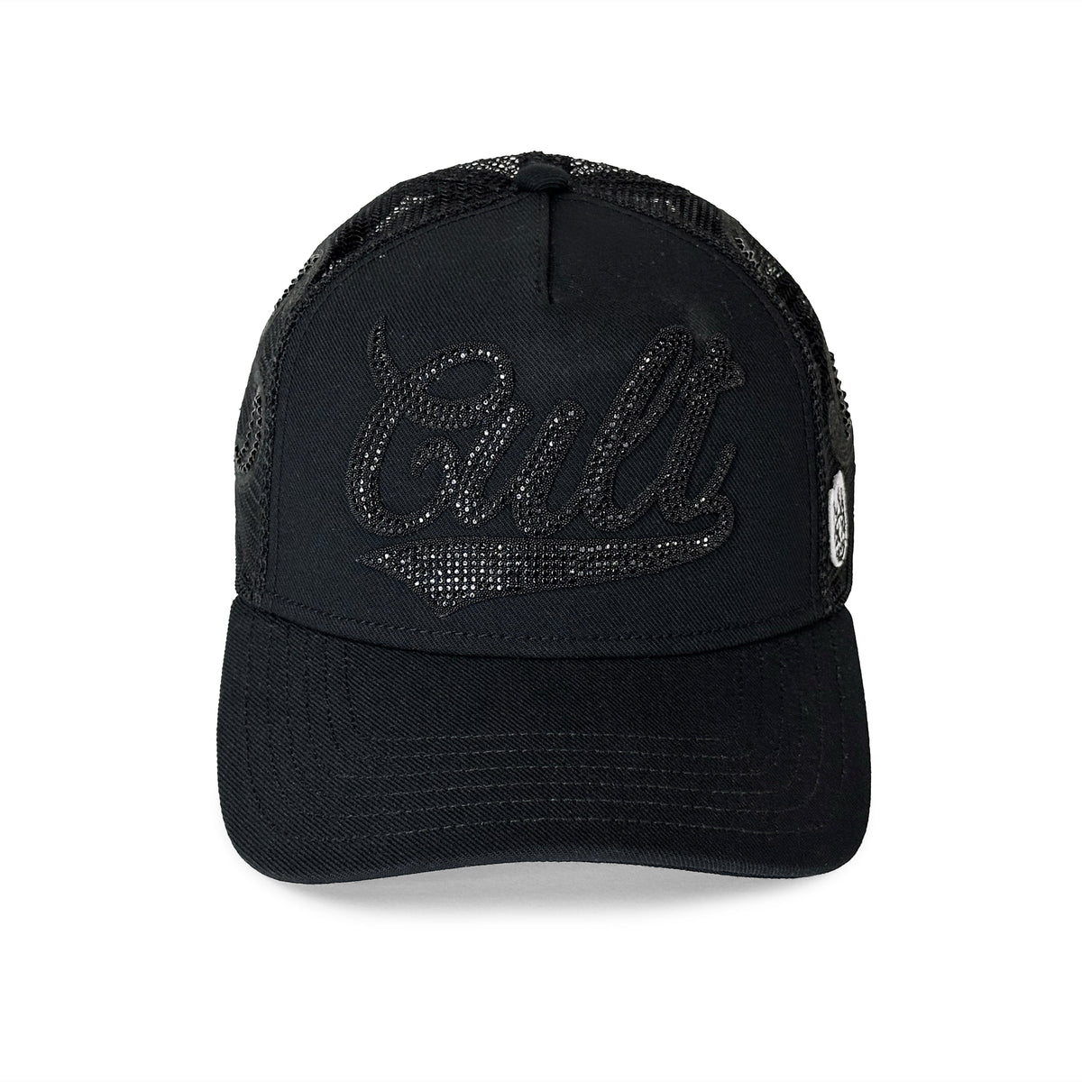 A black trucker-style cap with a curved brim, black mesh back, and a rhinestone-embellished 'Cult' logo on the front, shown against a plain white background.