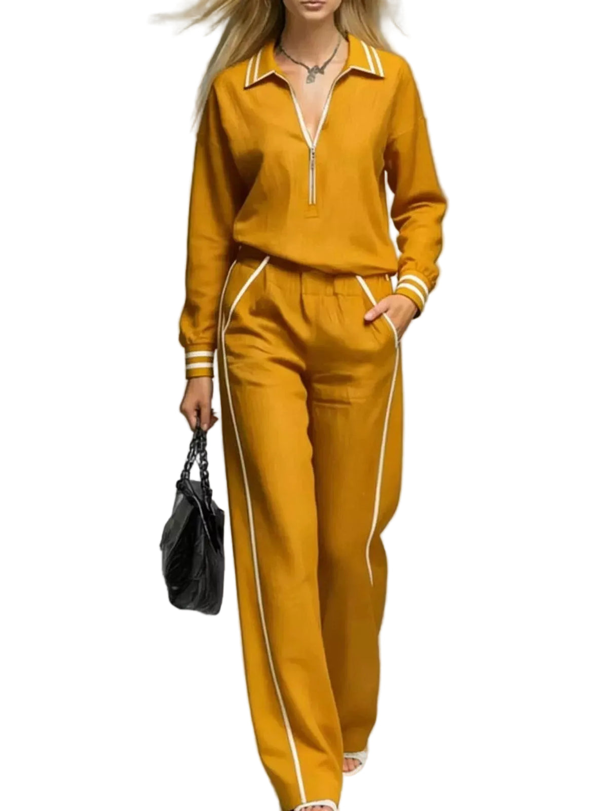 Woman wearing a mustard yellow tracksuit with white stripes on a gray background