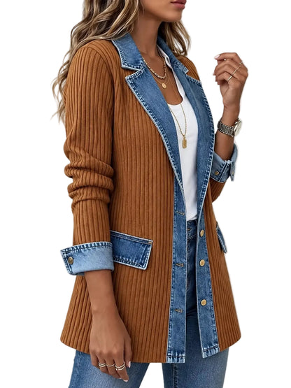 A woman wearing a brown ribbed knit cardigan with a blue denim collar, front placket, cuffs, and patch pockets, styled over a white top and blue jeans against a plain white background.