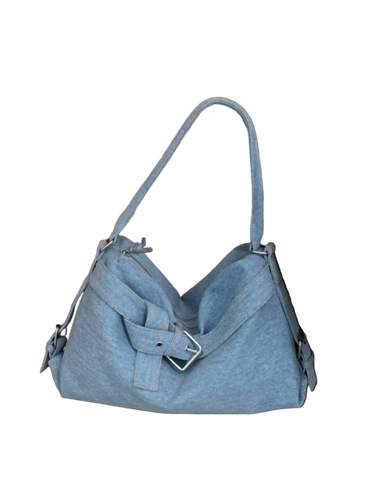 A light blue denim shoulder bag with a front flap and buckle detail, resting on a wooden floor next to a bed with white bedding.