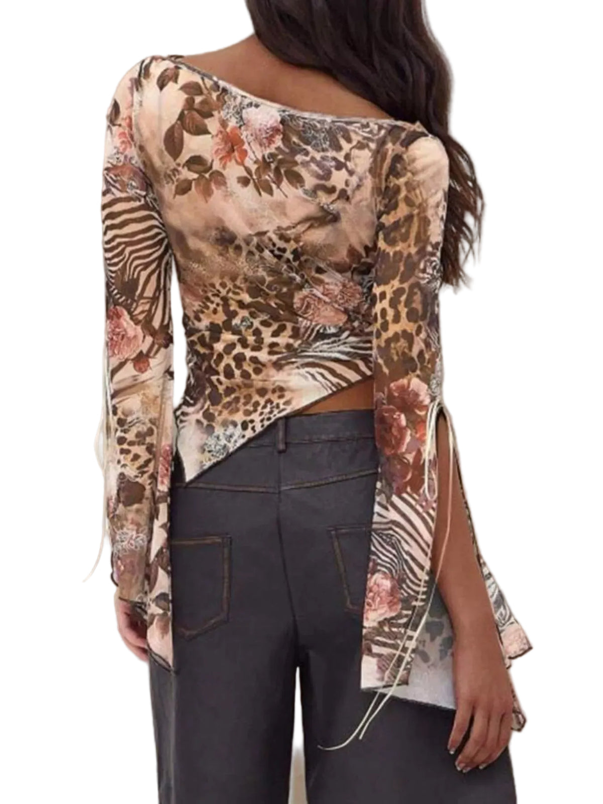 A woman shown from the back wearing a long-sleeve off-the-shoulder top with a mixed animal and floral print in beige, brown, black, and pink, paired with dark gray jeans against a textured beige wall.