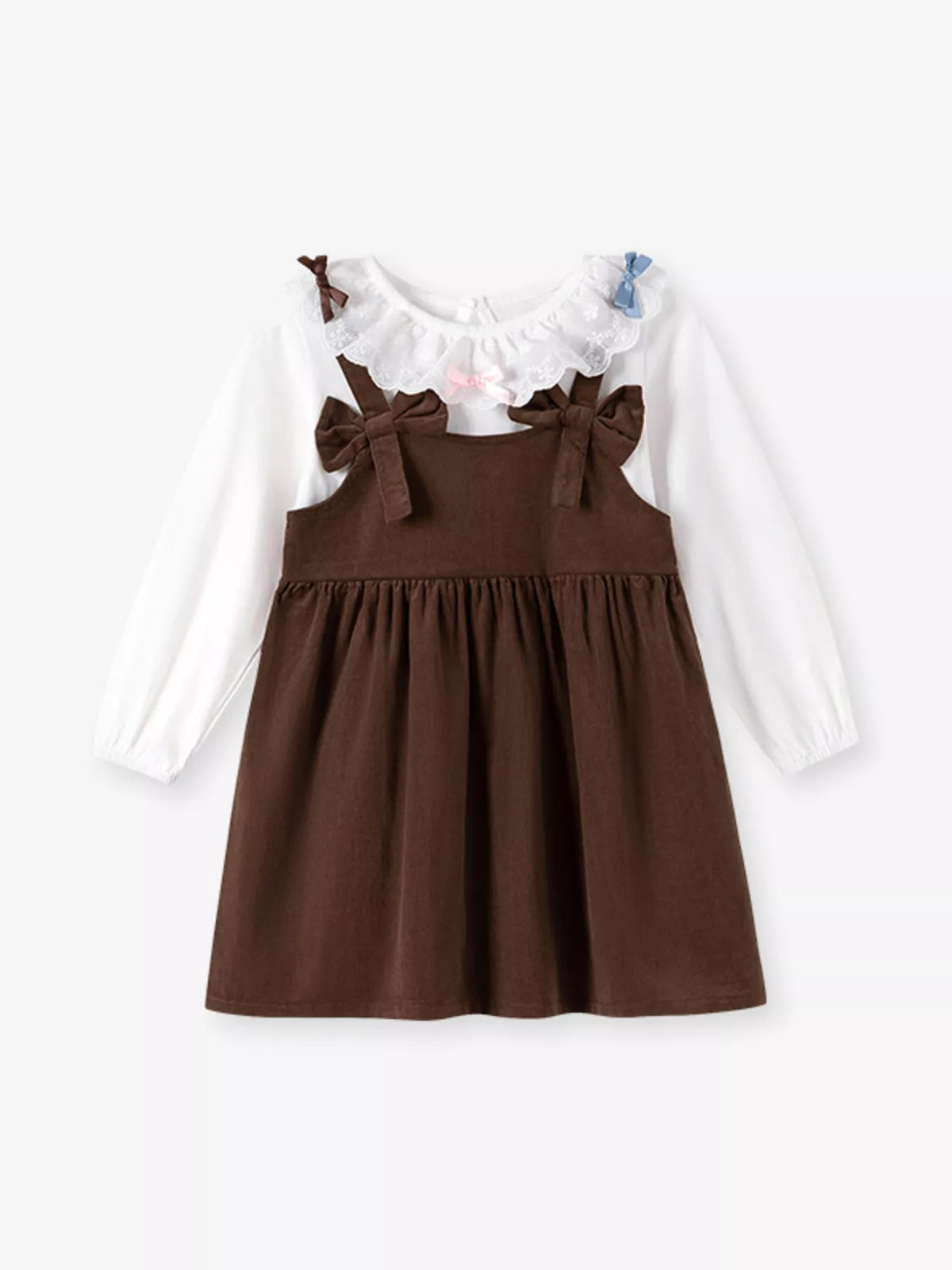 A toddler girl's long-sleeve dress featuring a brown pinafore-style skirt with shoulder bows over a white long-sleeve top, accented with a ruffled collar.