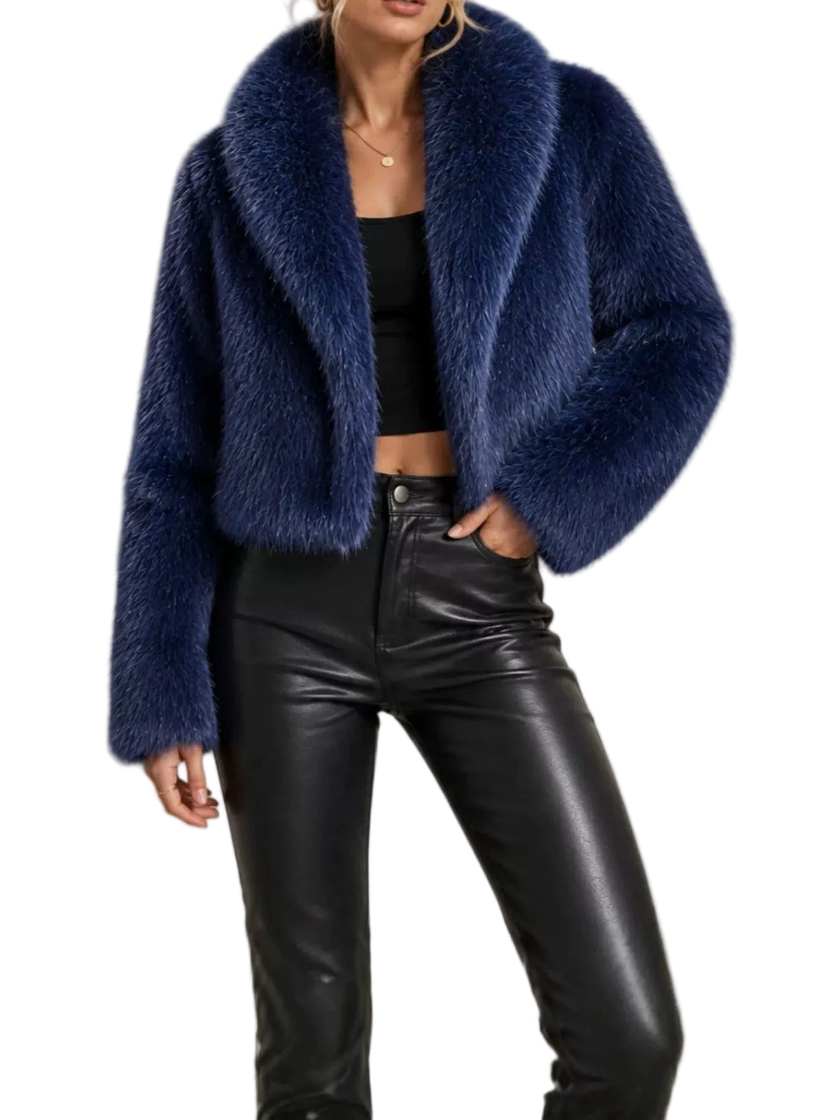 A woman wearing a cropped, plush navy blue faux fur jacket over a black crop top and black faux leather pants, photographed against a plain light background.