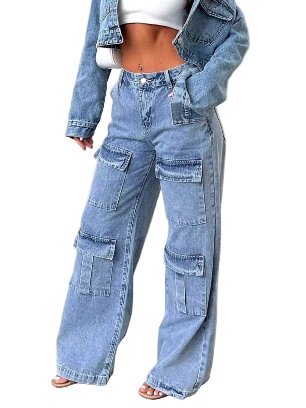 A person wearing light-wash blue wide-leg cargo jeans with a white crop top and an open denim jacket, standing indoors against a light neutral wall and concrete floor.