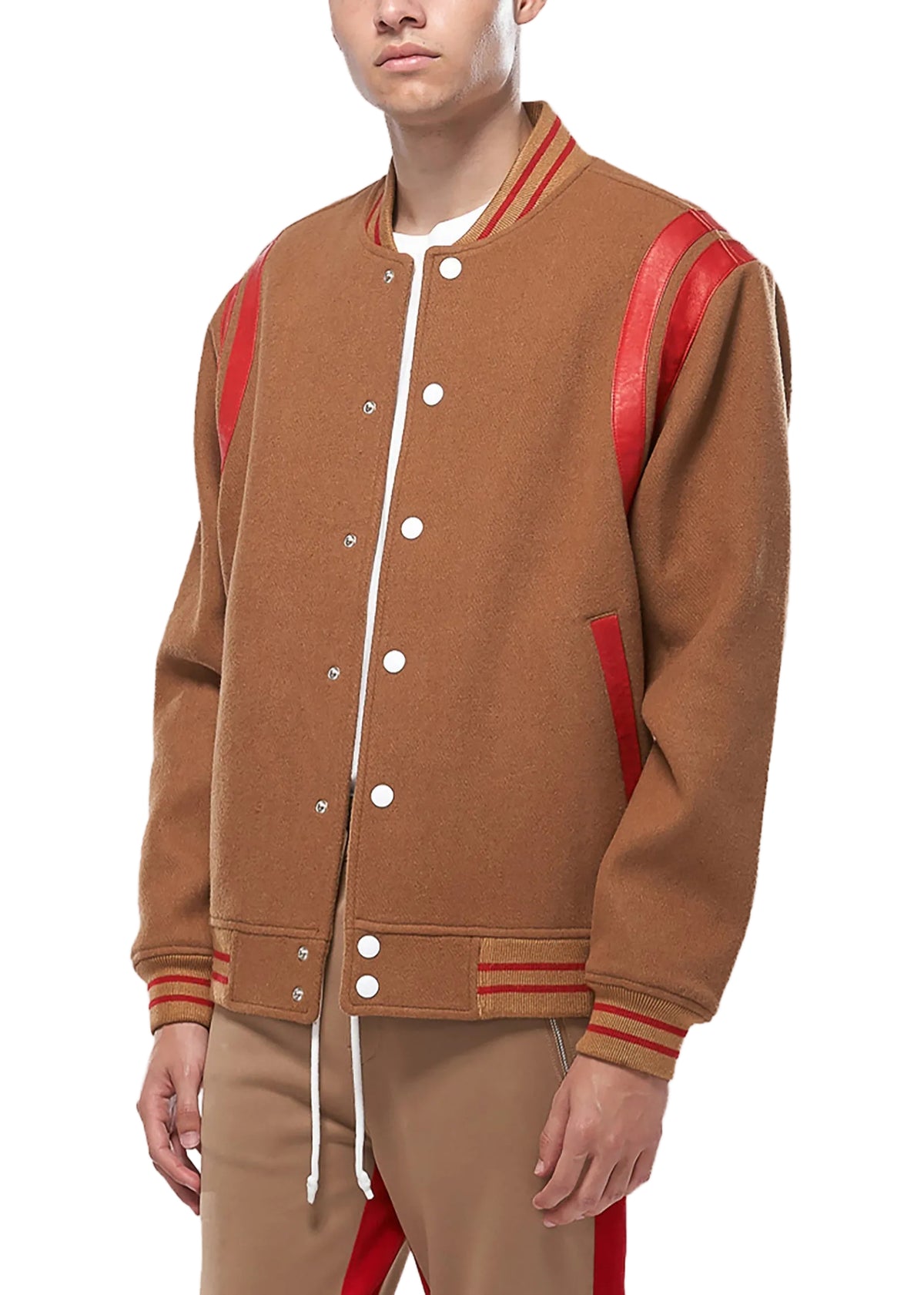 Person wearing a brown varsity jacket with red accents on a white background