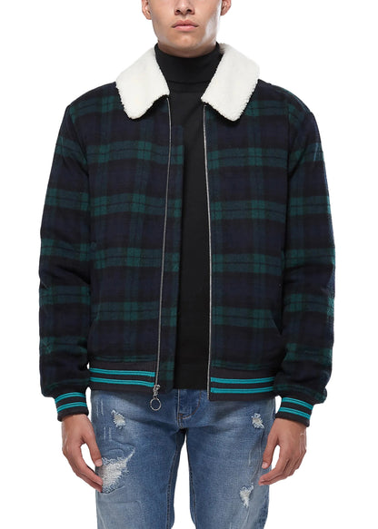Person wearing a plaid jacket with a white collar on a white background