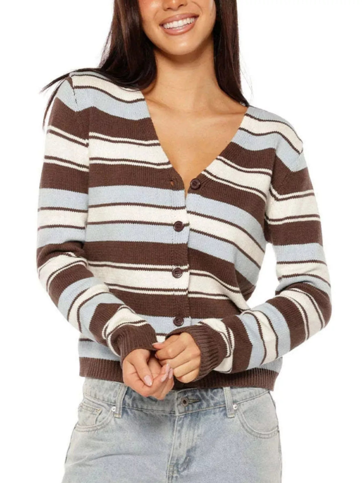 A woman wearing a brown, cream, and light blue striped cardigan sweater with button-front closure, paired with light-wash jeans against a plain white background.