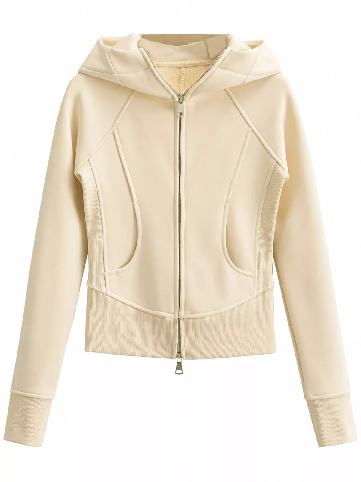A cropped zip-up hoodie in a light cream or off-white color, featuring diagonal seam details, a front zipper, and a hood, shown against a plain white background.