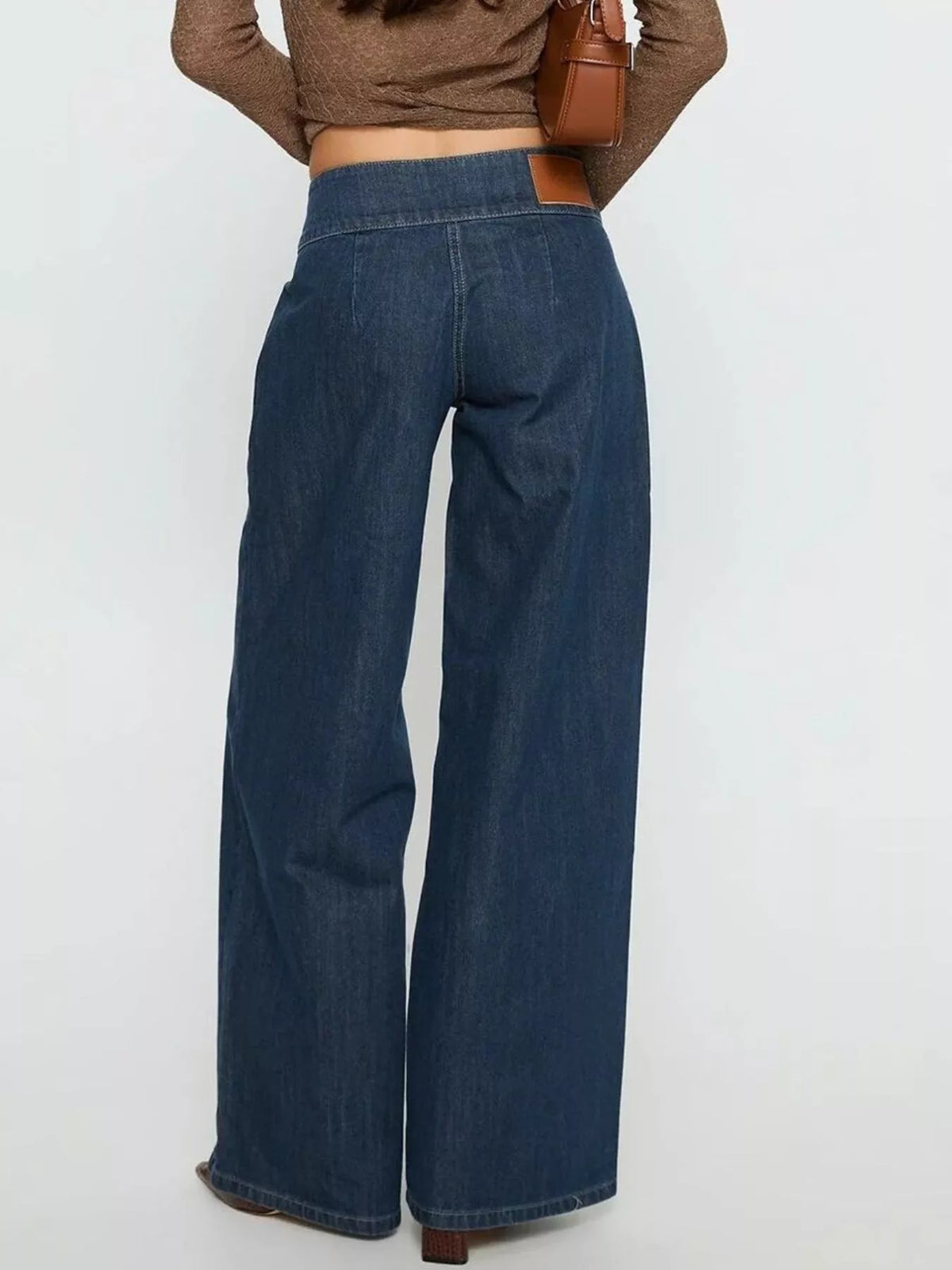 High-waisted wide-leg jeans with zippered pockets