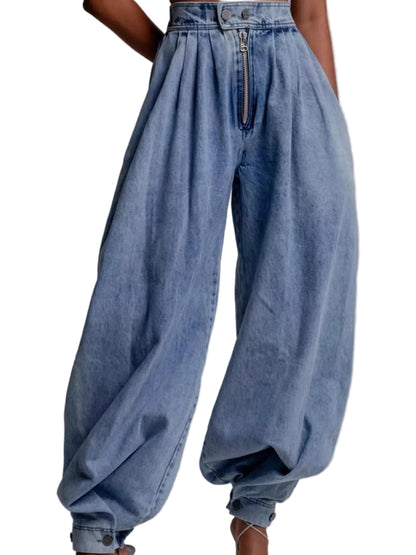 Light blue high-waisted wide-leg denim pants with a front zipper, modeled on a person against a plain light gray background.
