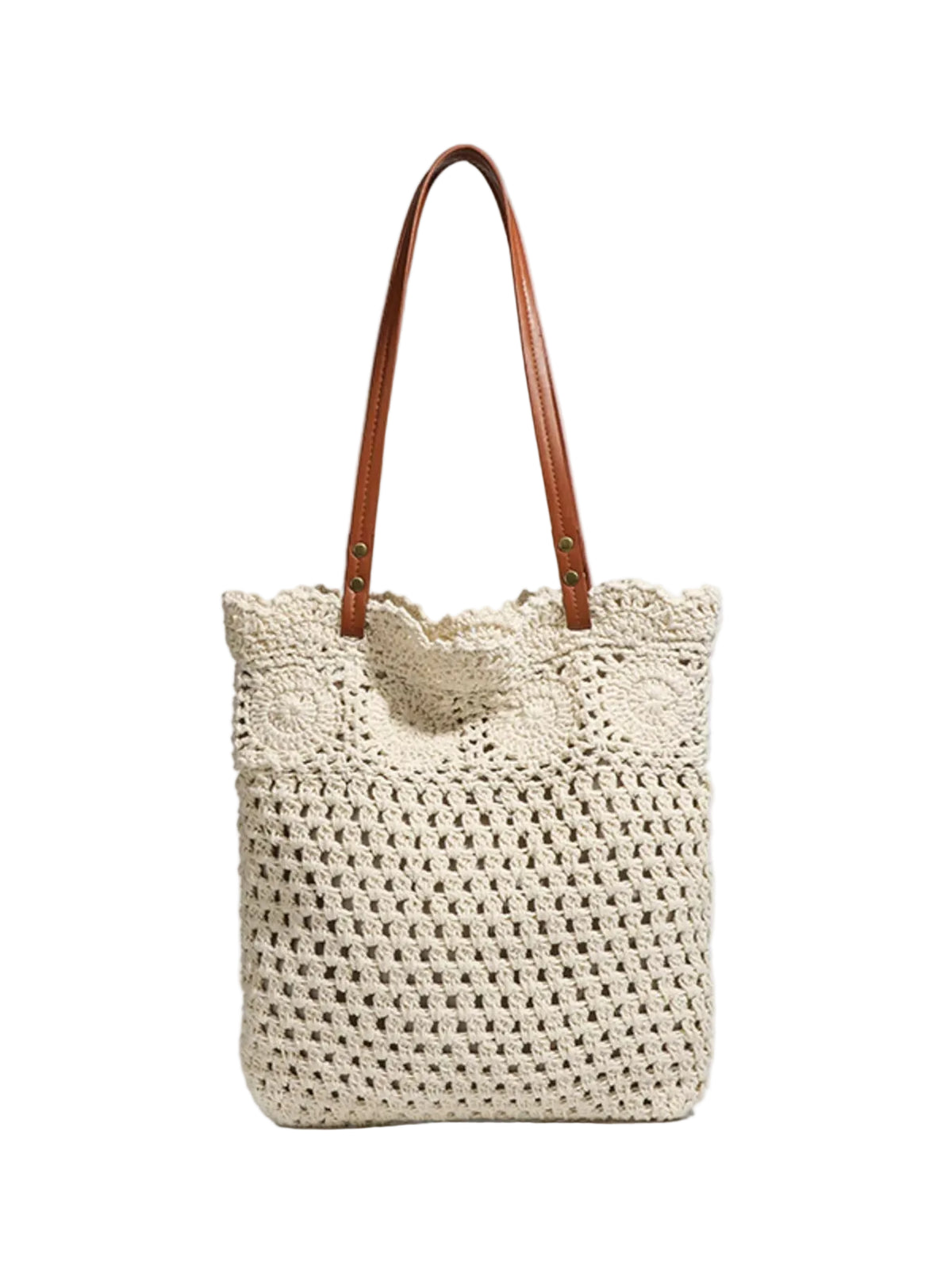 A cream-colored crocheted tote bag with brown leather shoulder straps, shown against a light gray background.