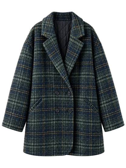 A double-breasted plaid blazer coat in a dark blue and green tweed pattern, featuring a notched lapel and dark buttons, shown against a plain light background.
