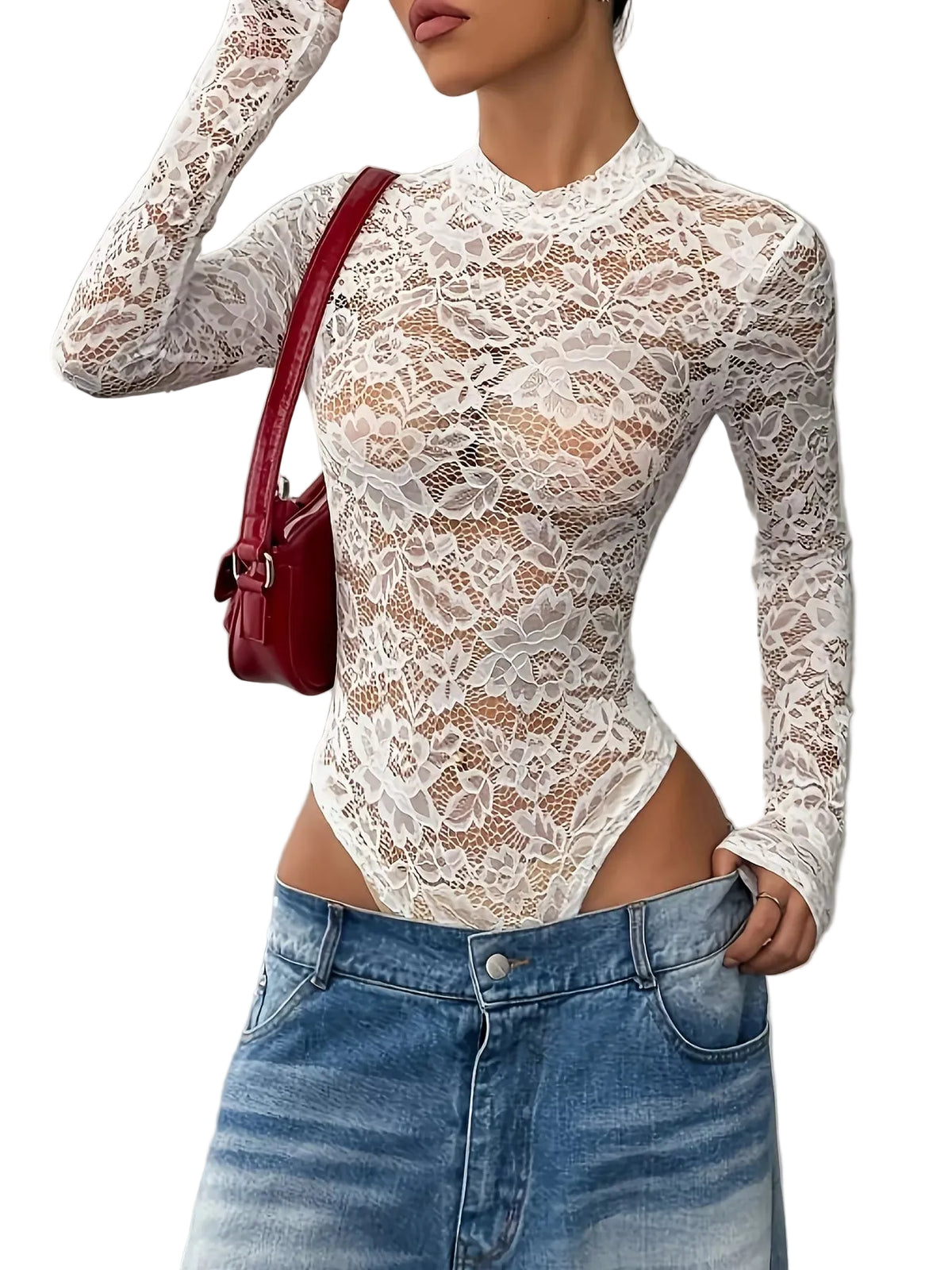 A woman wearing a white long-sleeve lace bodysuit with a high mock neck, paired with blue denim shorts and a red shoulder bag, shown against a gray wall.
