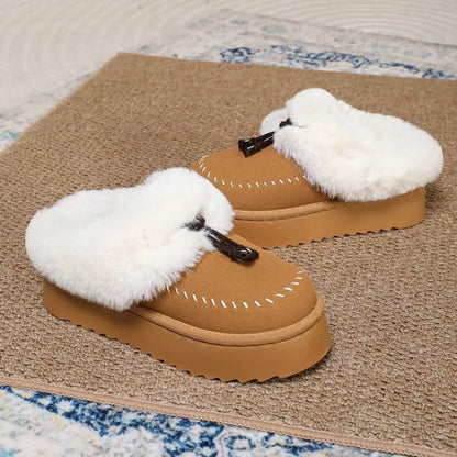 Plush faux fur-lined platform slippers with tassel detail