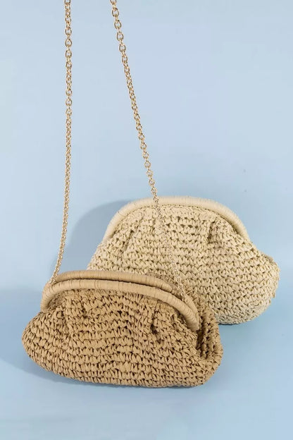 Beige woven handbag with a chain strap on a light blue background