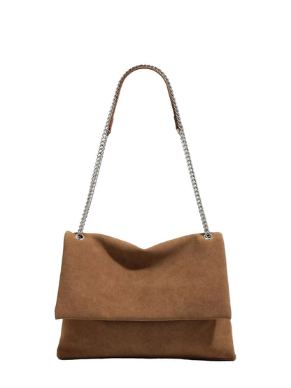 A brown suede shoulder bag with a silver-tone chain strap, shown against a plain white background.
