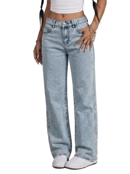 A model wearing a pair of light-wash, wide-leg denim jeans with a faded wash effect, styled with a white crop top and white sneakers against a plain white background.