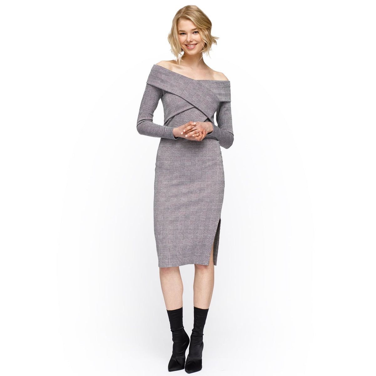 Woman wearing a gray off-shoulder dress on a white background