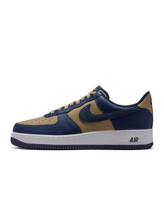 Navy and brown sneaker with Nike logo on a white background