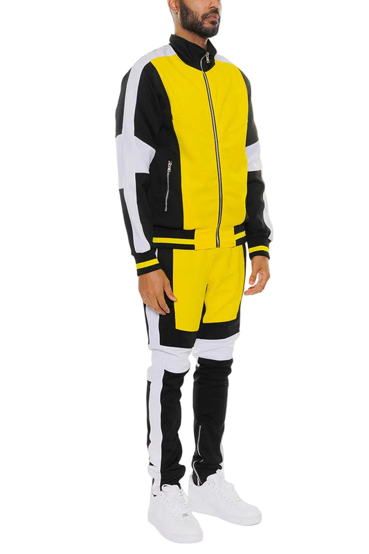 Person wearing a yellow and black tracksuit on a white background