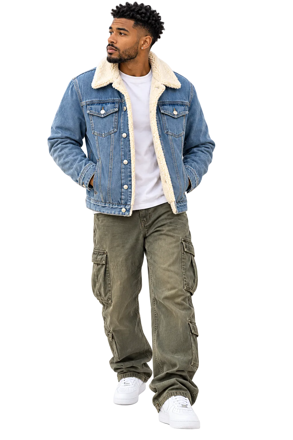 A man wearing a blue denim jacket with a cream sherpa collar, a white t-shirt, olive green cargo pants, and white sneakers, standing against a plain white background.
