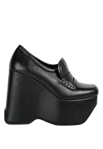 Black platform shoe on a white background