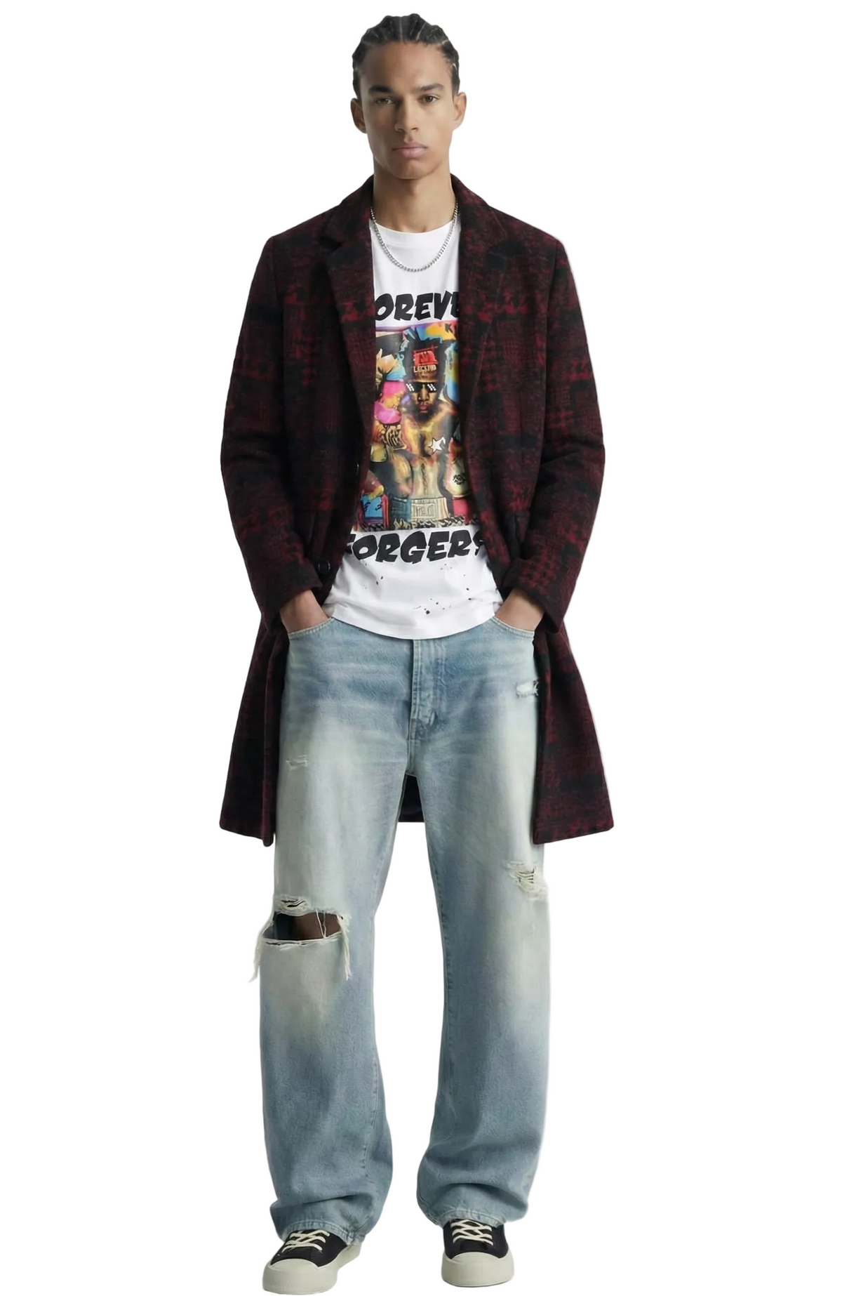 A model stands against a white background wearing a long dark red and black plaid coat over a white graphic t-shirt, light-wash distressed jeans, and black low-top sneakers.