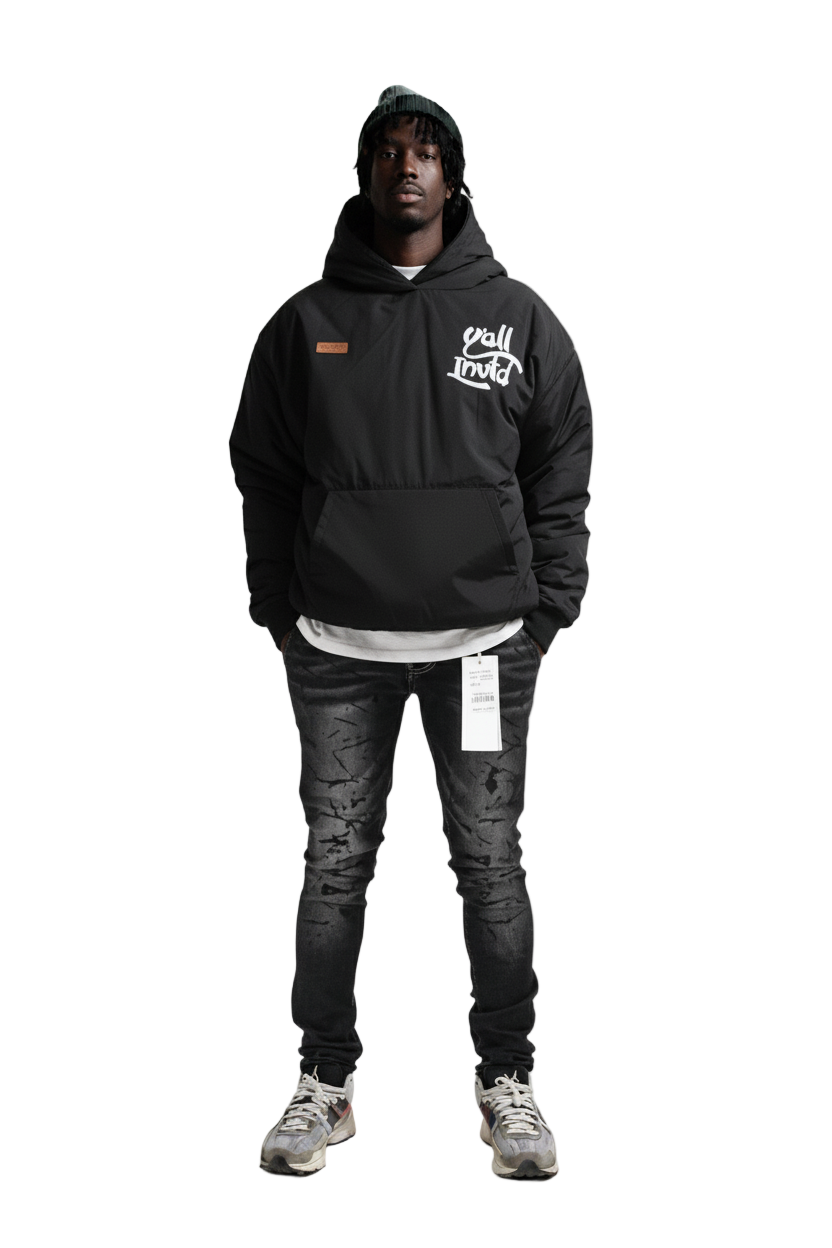 Person wearing a black hoodie with a logo on a white background