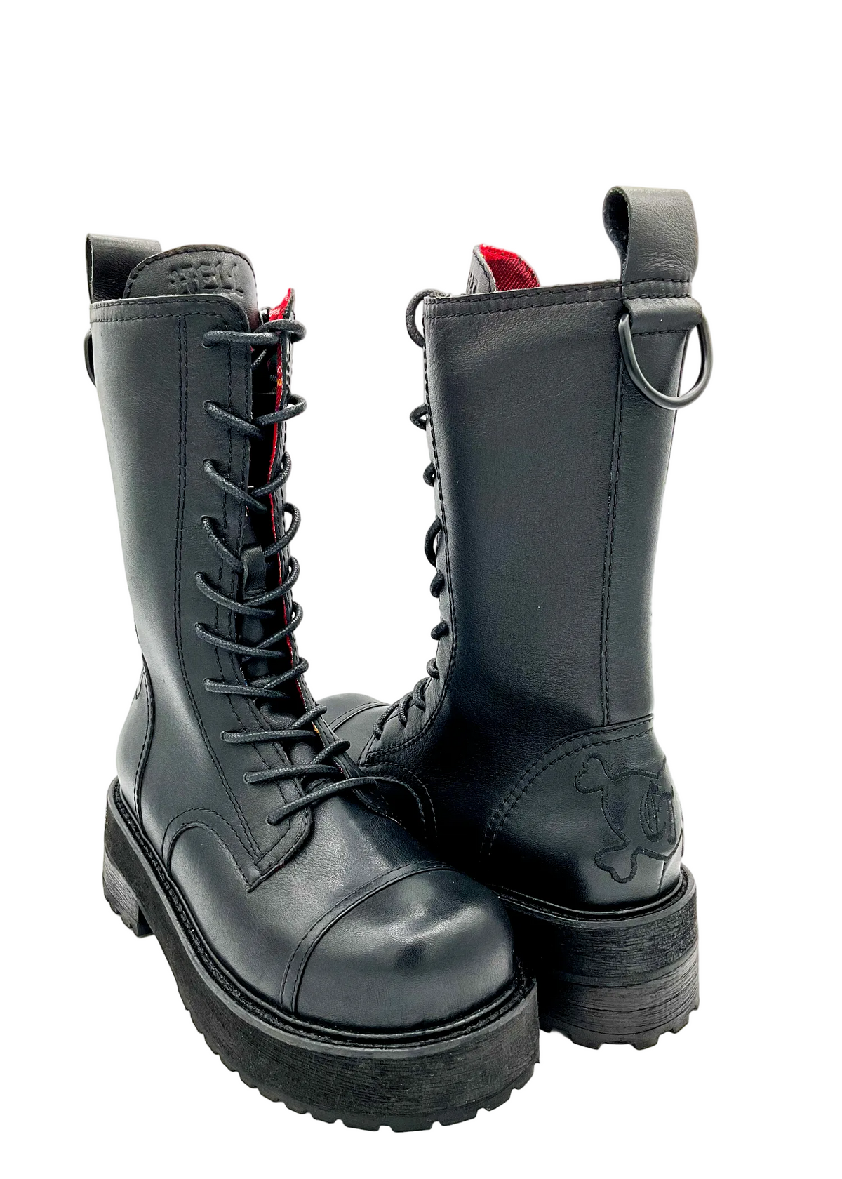 Pair of black leather boots with red lining on a white background