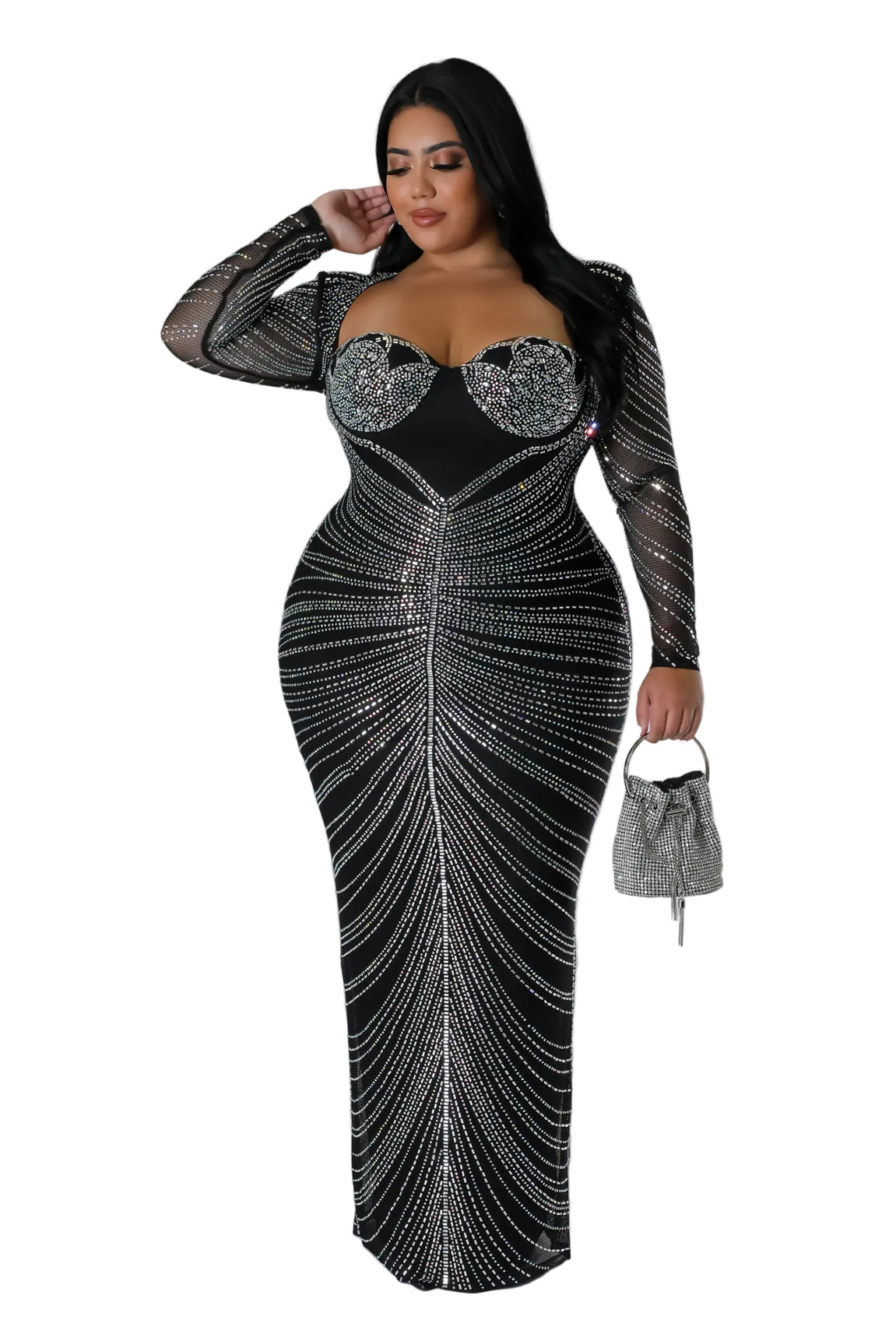 A woman modeling a floor-length black evening gown covered in silver rhinestone-like vertical lines, with sheer long sleeves and embellished bust panels, standing against a light gray studio background. She is holding a small silver handbag.