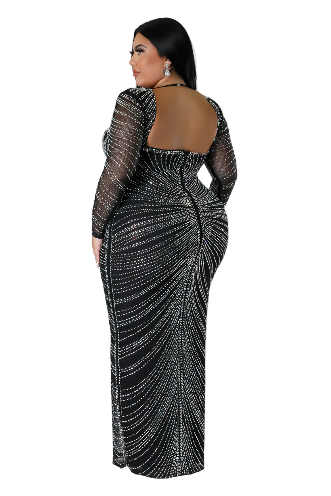 Woman wearing a sparkling black evening gown with sheer sleeves on a white background