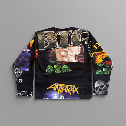 A long-sleeve black graphic sweatshirt laid flat against a neutral gray background, featuring 'BIG' in metallic letters across the chest, a central portrait print, green leaf graphics, 'ANTIFIRAX' in yellow on the lower front, and skull artwork on one sleeve.