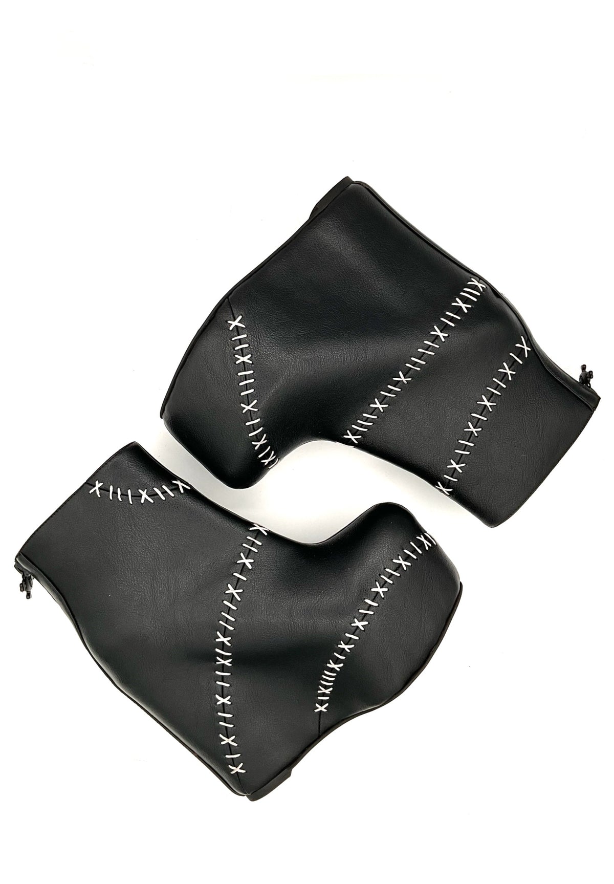 Black leather glove with white stitching on a white background