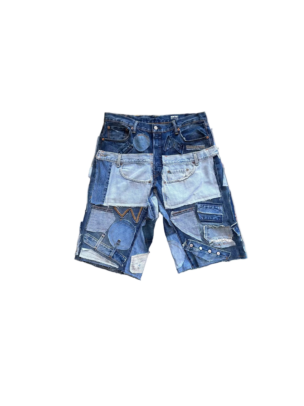 Stack of denim shorts on a colorful abstract background