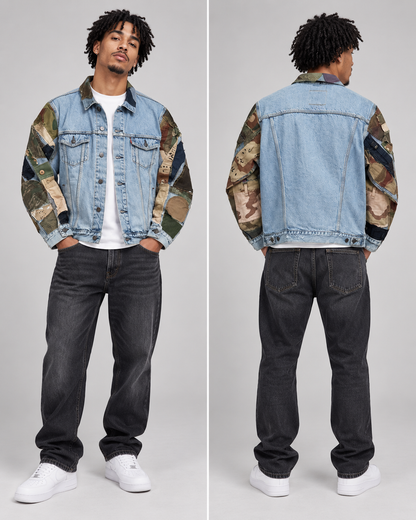 A model shown from the front and back wearing a light blue denim jacket with camouflage patterned sleeves, paired with dark gray jeans and white sneakers, against a light gray studio background.