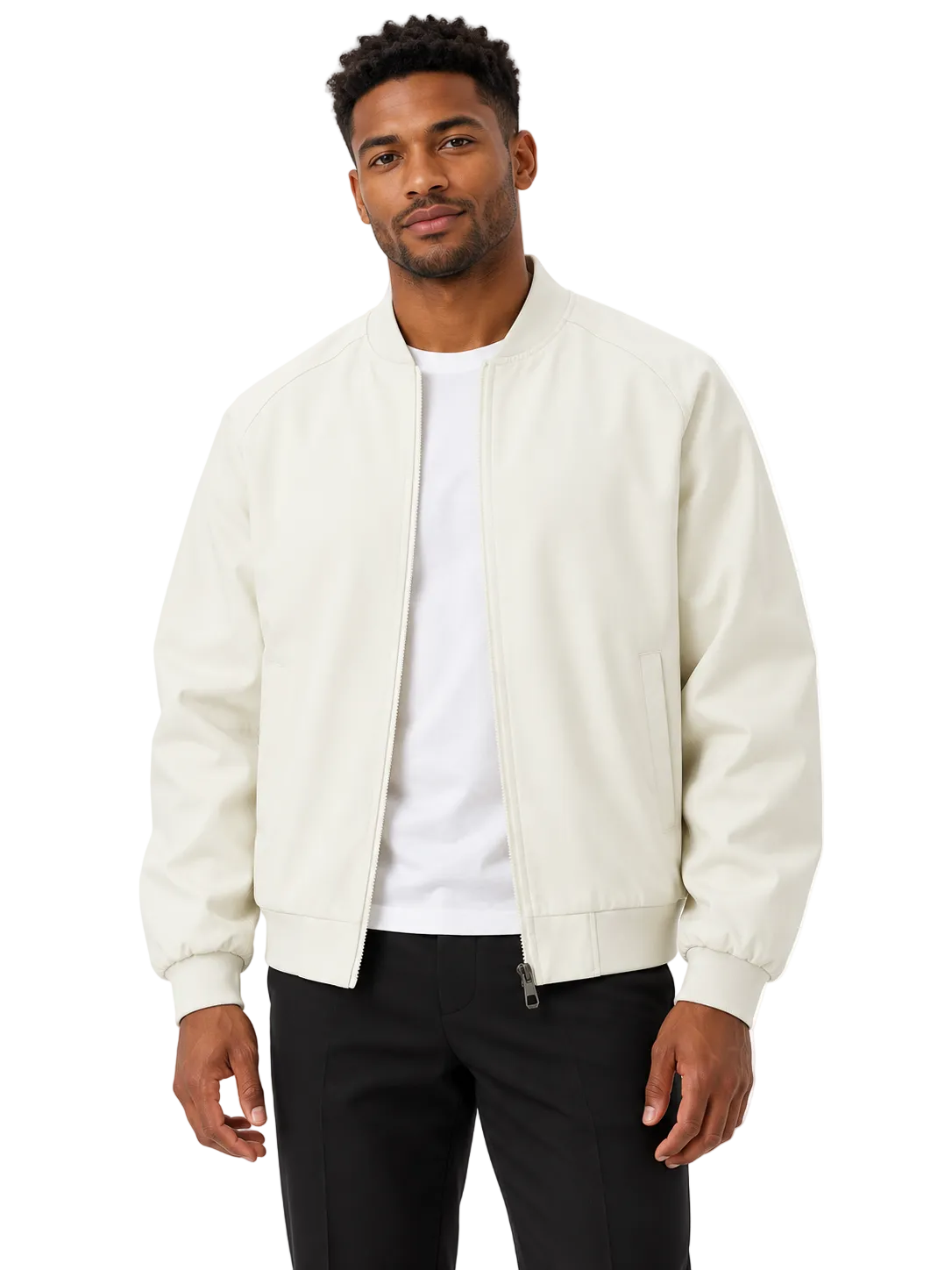 A man wearing a cream-colored leather bomber jacket over a white t-shirt and black pants, standing against a plain white background.