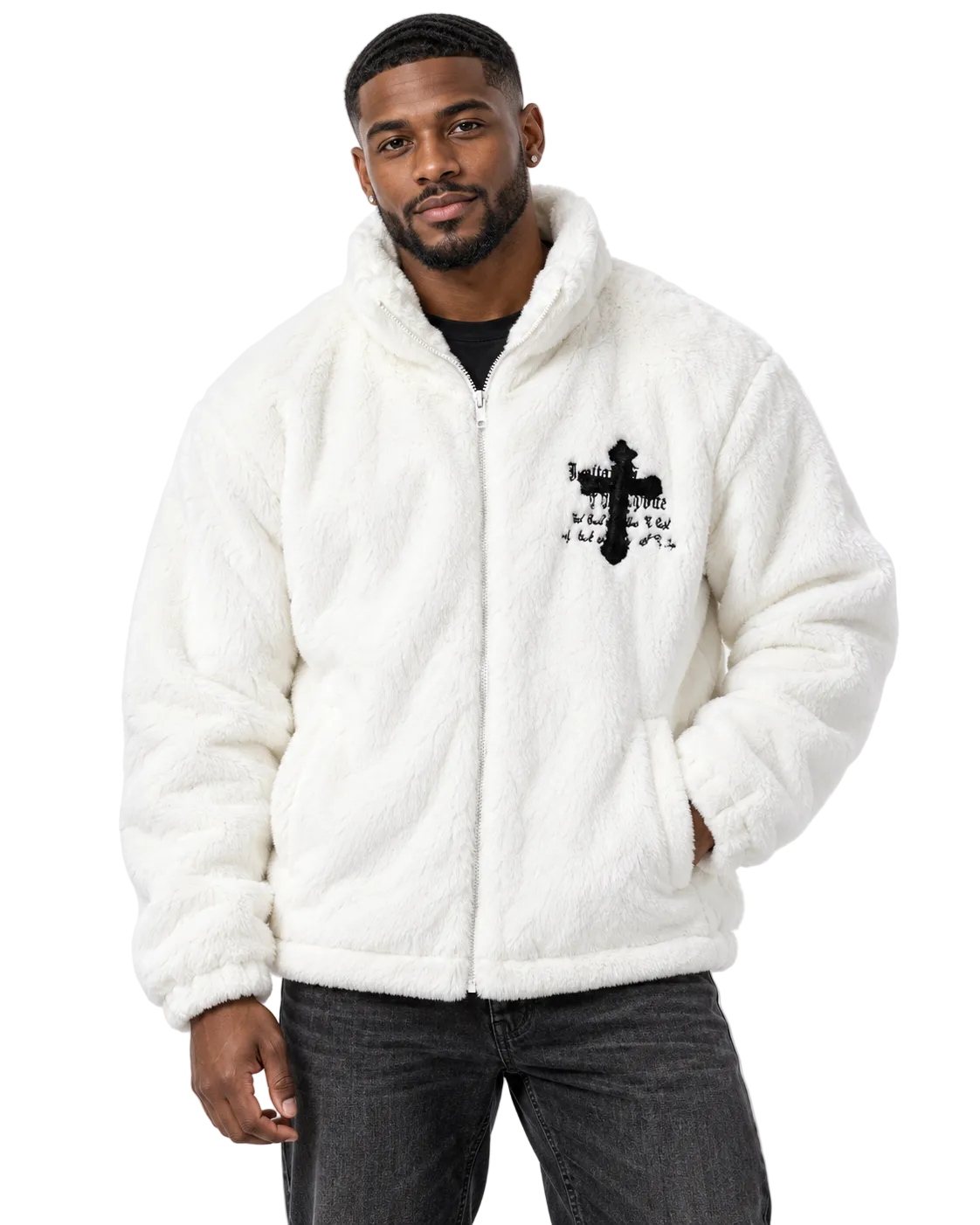 A man wearing a white sherpa fleece zip-up jacket with a black cross graphic on the chest, paired with dark gray jeans, against a plain white studio background.