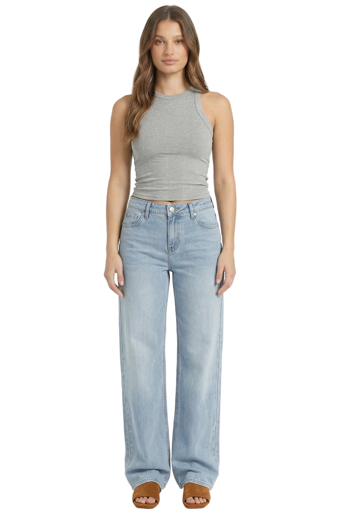 Woman wearing a gray tank top and light blue jeans on a white background