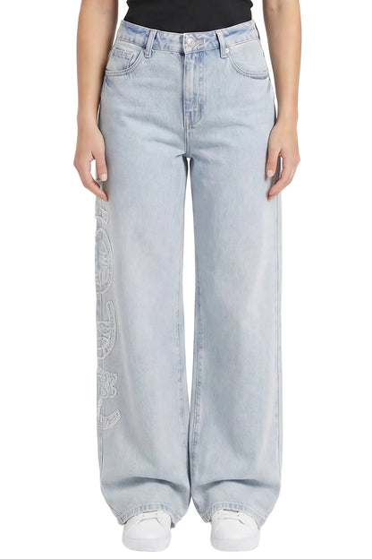 Light blue jeans worn by a person on a white background