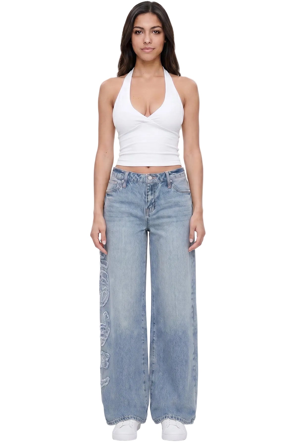 Woman wearing a white halter top and blue jeans on a white background