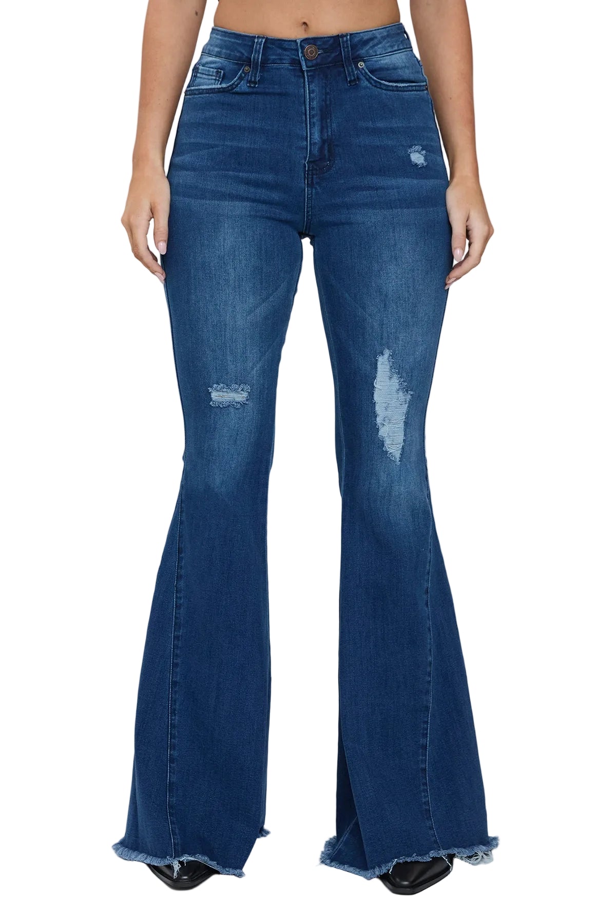 Blue flared jeans worn by a person on a white background
