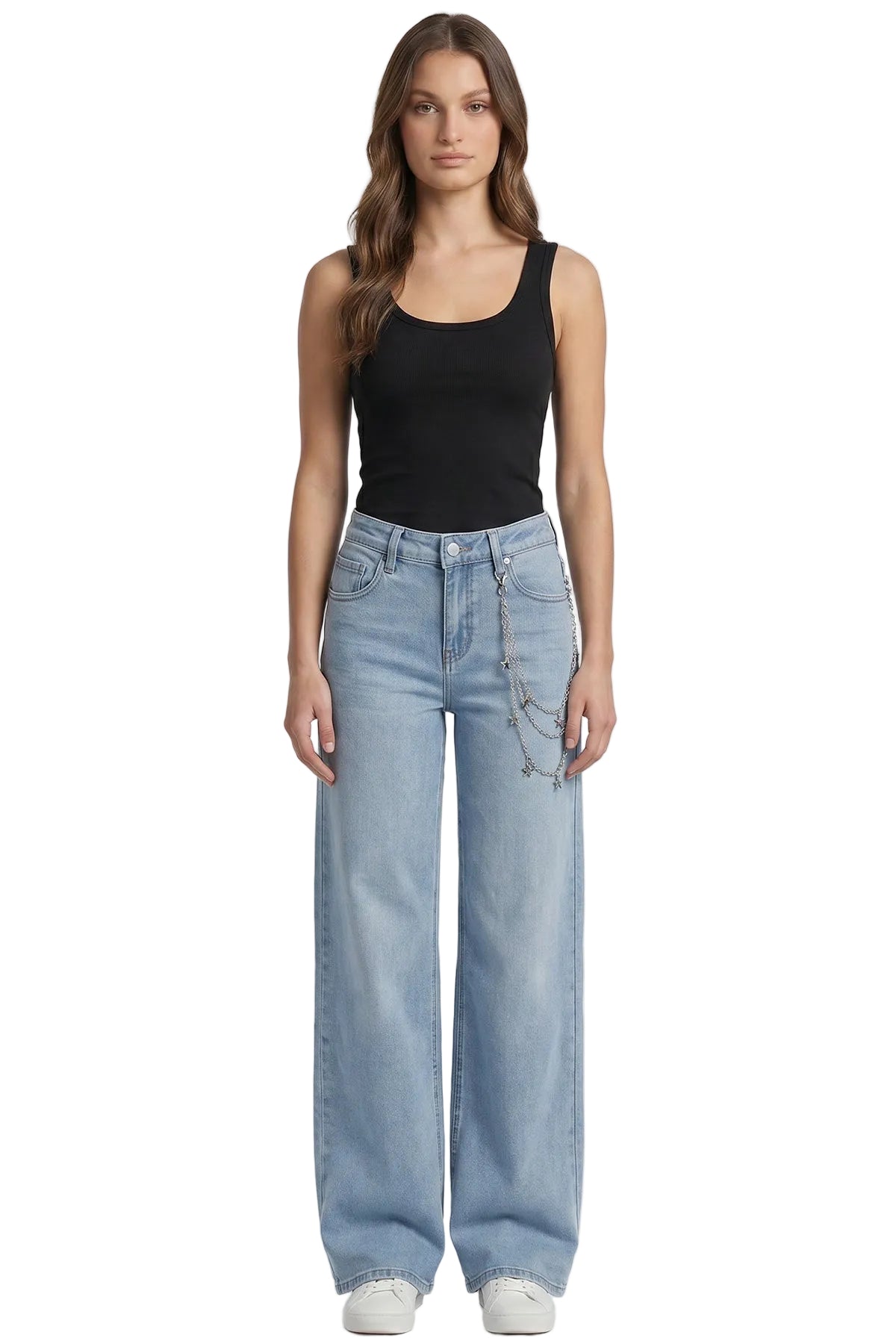 Woman wearing a black tank top and light blue jeans on a white background