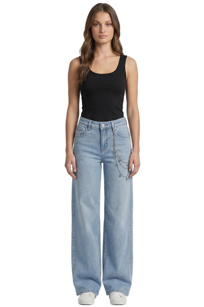Woman wearing a black tank top and light blue jeans on a white background