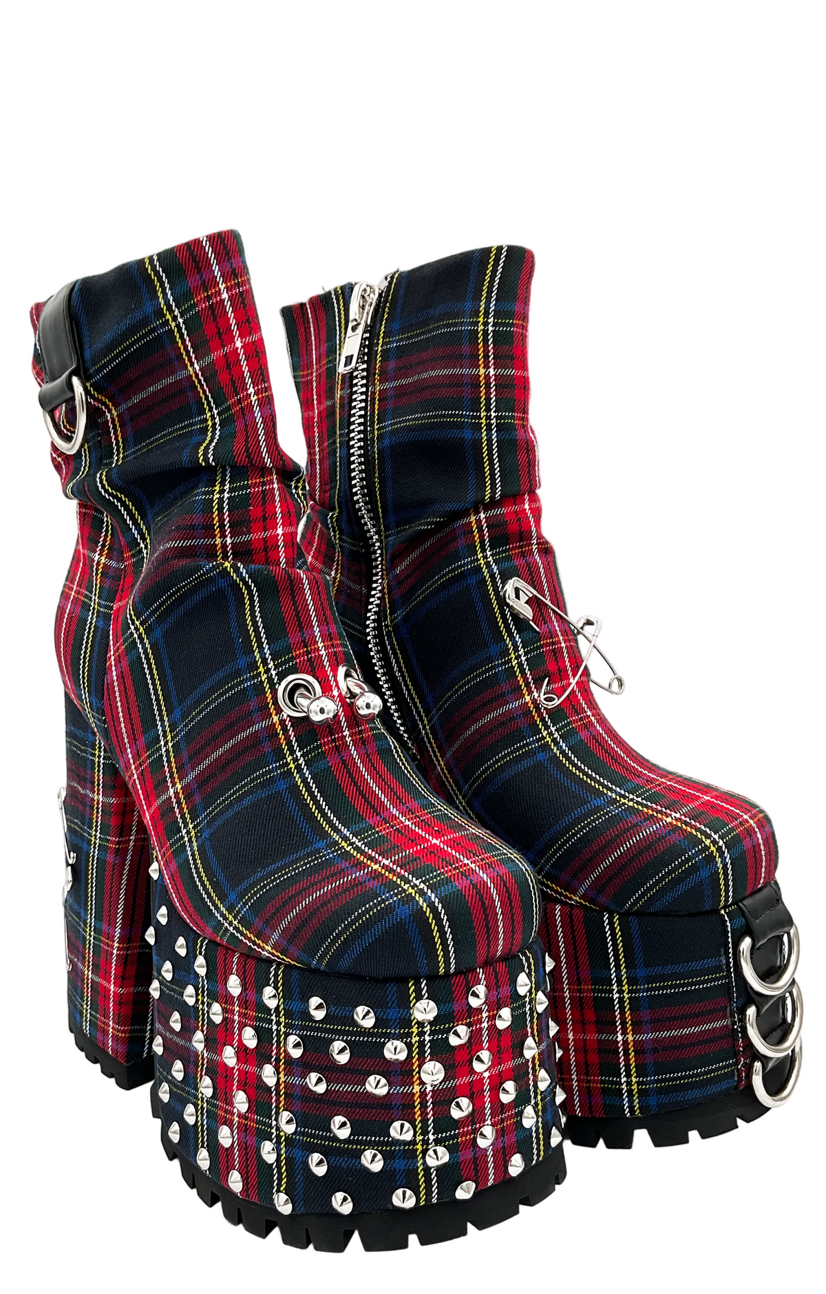 Plaid platform boots with studded details on a white background
