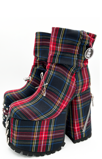 Plaid platform boots with zippers on a white background