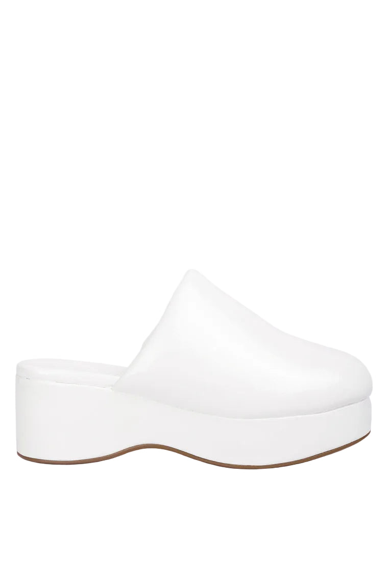 White platform clog shoe on a light gray background