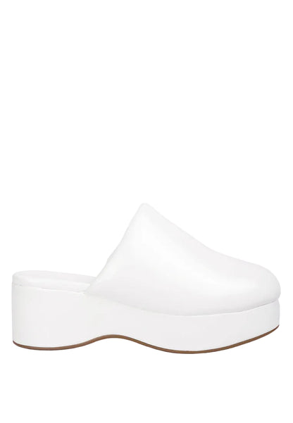 White platform clog shoe on a light gray background