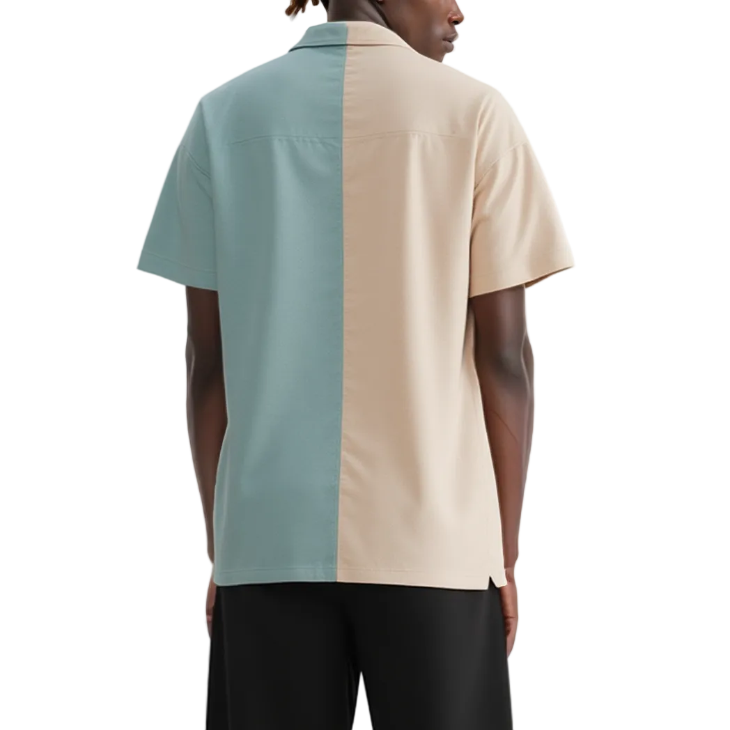 Person wearing a two-tone polo shirt with blue and beige sections on a white background