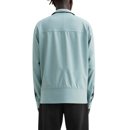 Light blue jacket worn by a person on a white background